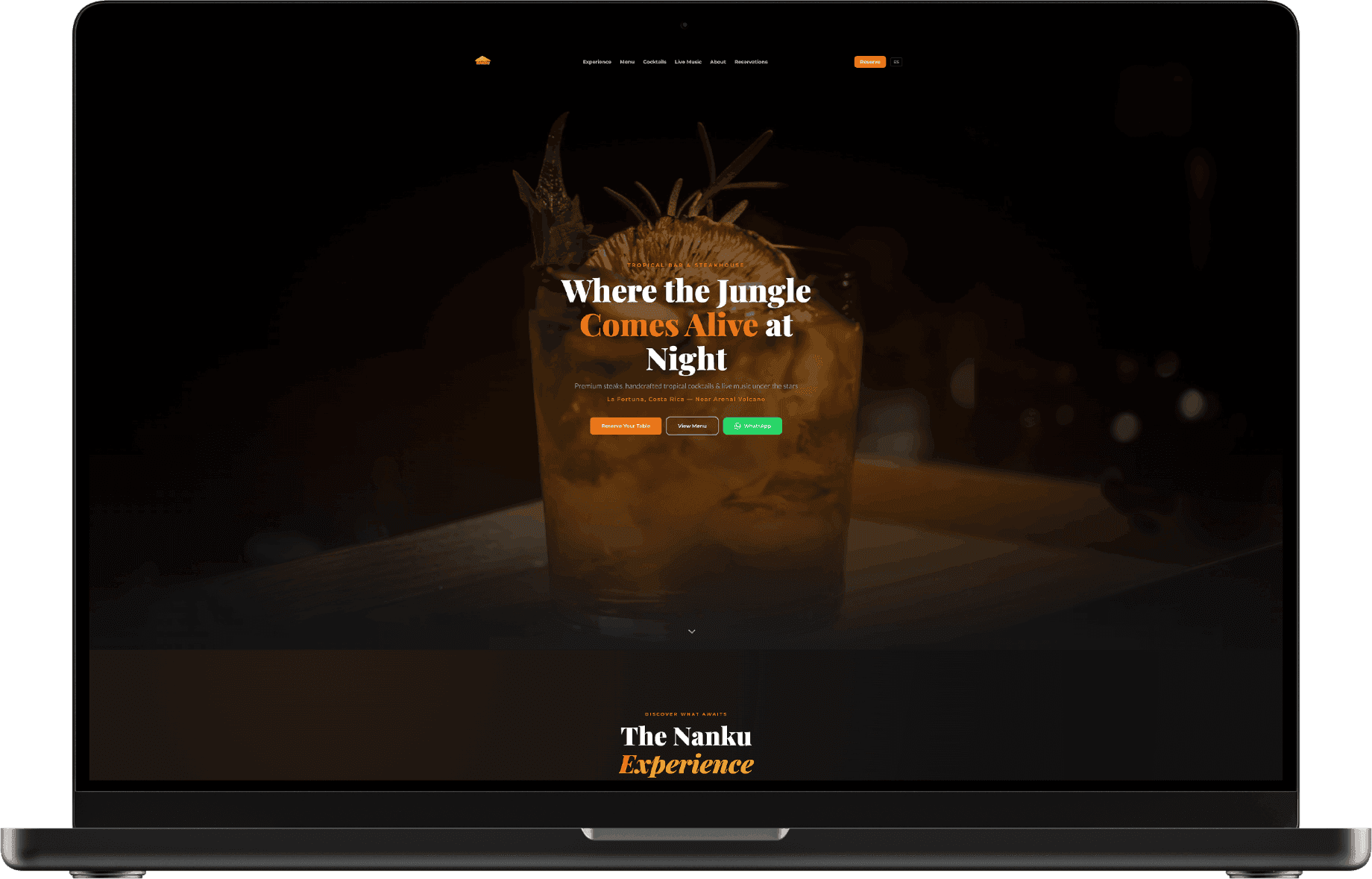Laptop with the Nanku home page and a house cocktail